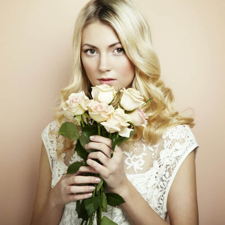 Portrait of a beautiful blonde woman with flowers