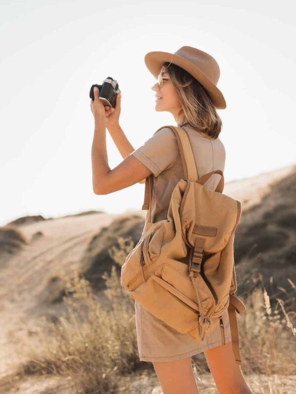 woman in desert walking on safari