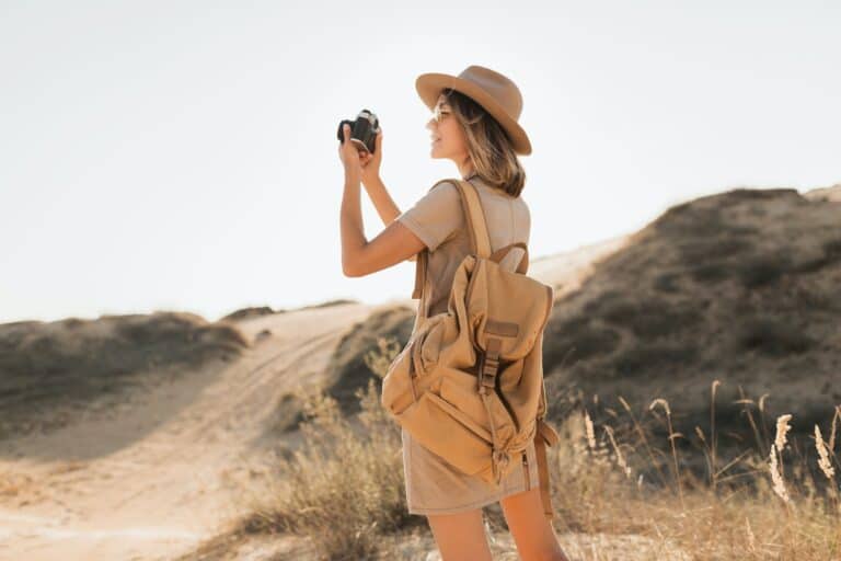 woman in desert walking on safari