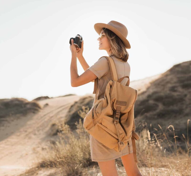 woman in desert walking on safari